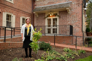 Carla Markell with the gordlinia donated to the governor's mansion by UD Botanic Gardens.
